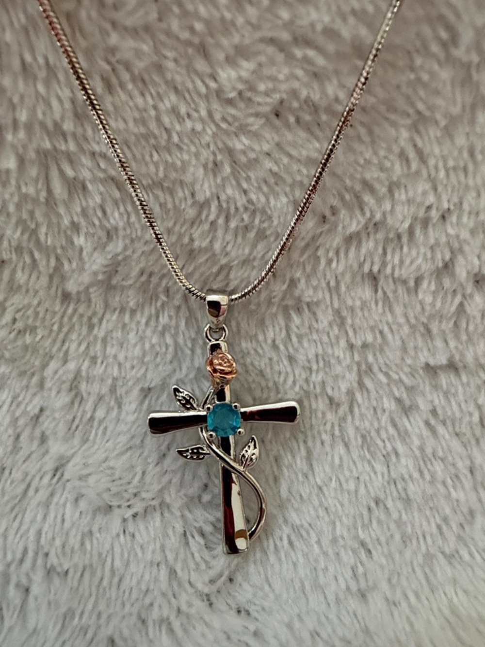 20 inch Silver Cross Pendant Necklace with Blue Stone and Rose Accent